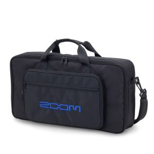 zoom-cbg-11-carrying-bag-for-g11 emi-hard carrying bag—black exterior, padded interior with blue lining, designed for Zoom G11 Multi-Effects Processor; features top handle and detachable padded shoulder strap